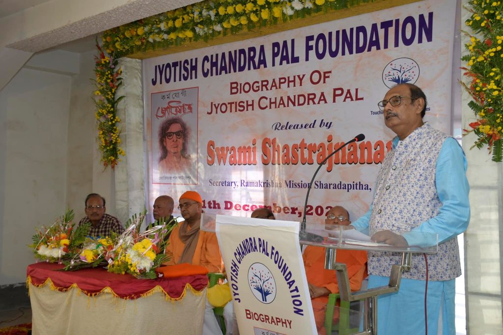 Tarun Kanti Pal speaking at a podium during the release of the biography of Jyotish Chandra Pal